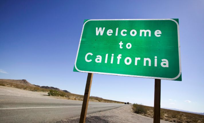 A welcome to California sign is at the side of the road for people wondering about CalAIM.